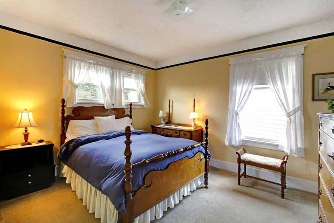 Elegant old english style bedroom with yellow walls, What Curtains Go With Yellow Walls? [Inc. 16 Photo Examples]