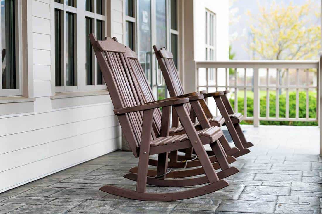 Front porch of house with brown rocking chairs