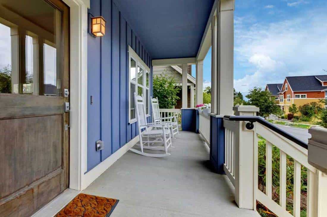 Front porch with gray door and blue color wall, 29 Covered Front Porch Designs [Inc. Colonial, Rustic and Modern]