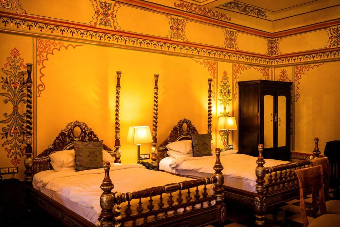 Indian themed bedroom with yellow lights and luxurious bed, Indian Themed Bedroom Ideas and Examples