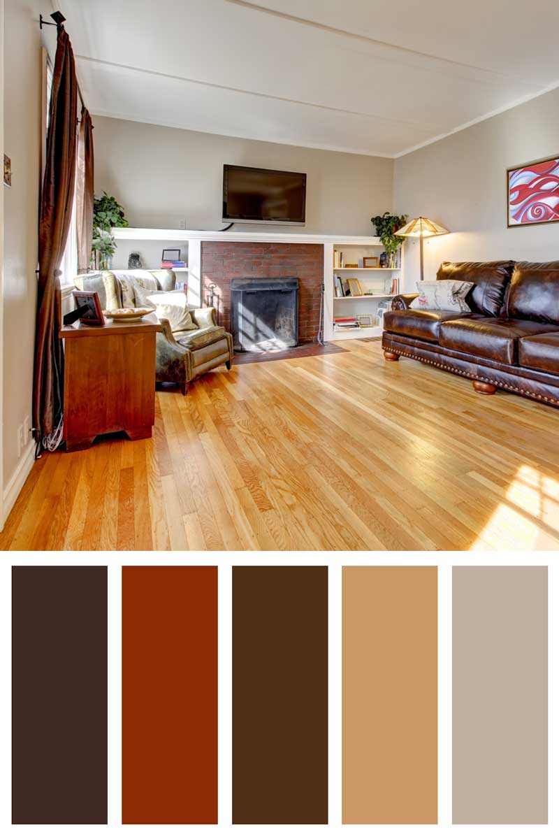 Living room with leather sofa, fireplace and TV. Rust Red Tones Play Nicely With Browns