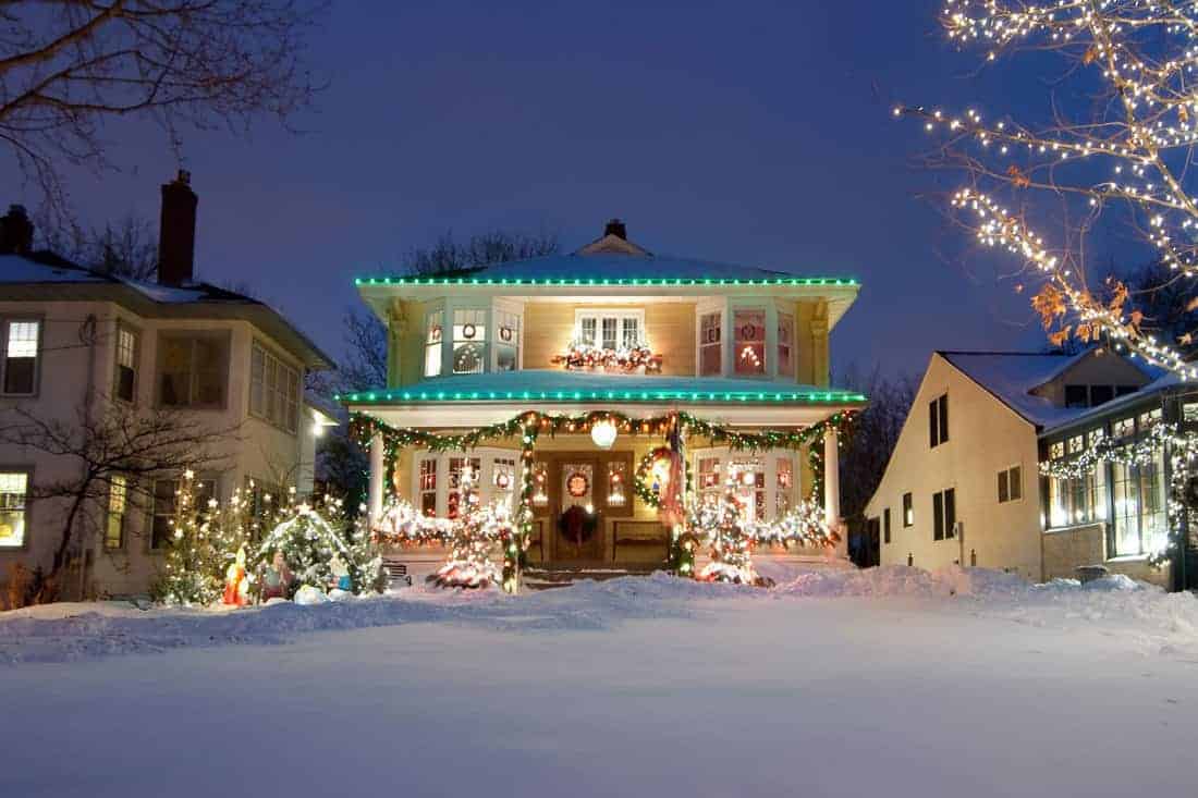 Luxurious house with christmas lights attached on the porch and fascia boards, 15 Christmas Porch Decorating Ideas [With Pictures]