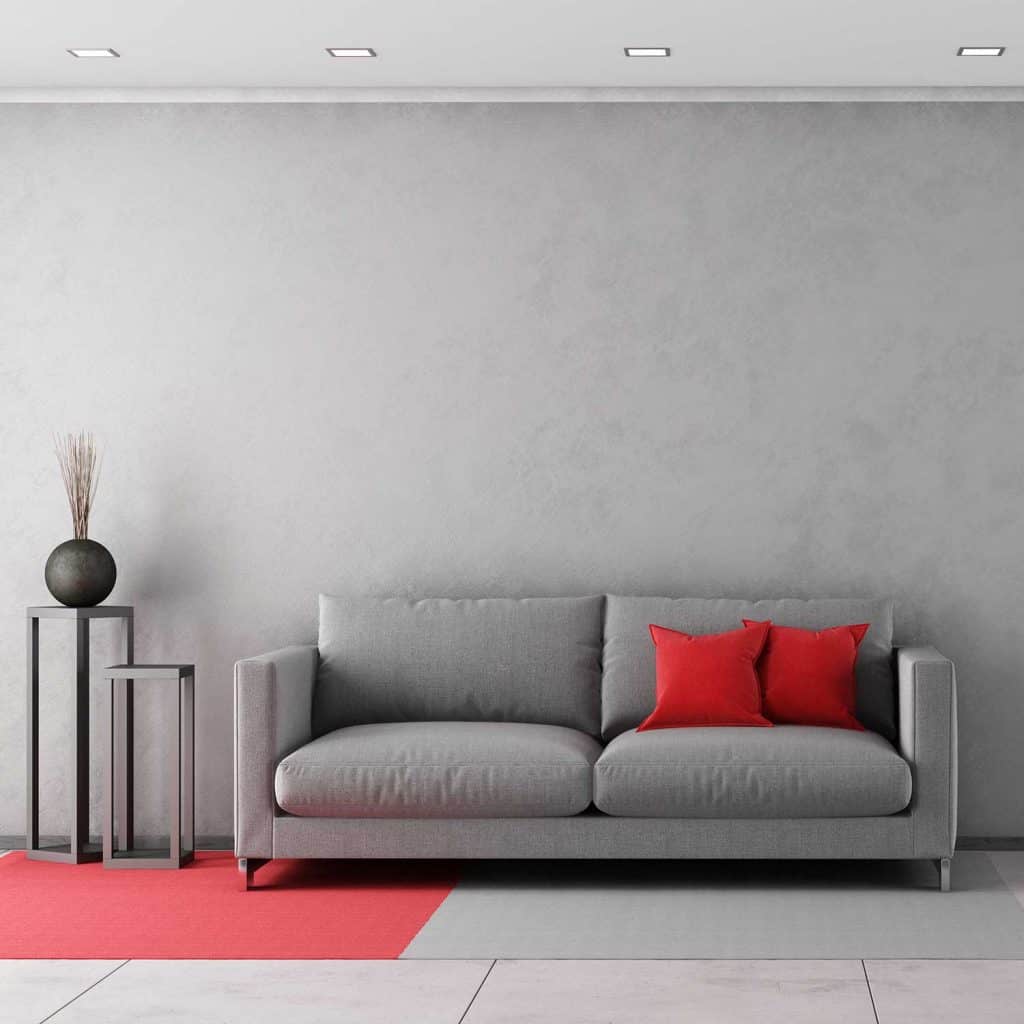 Contemporary living room with gray sofa and red throw pillows