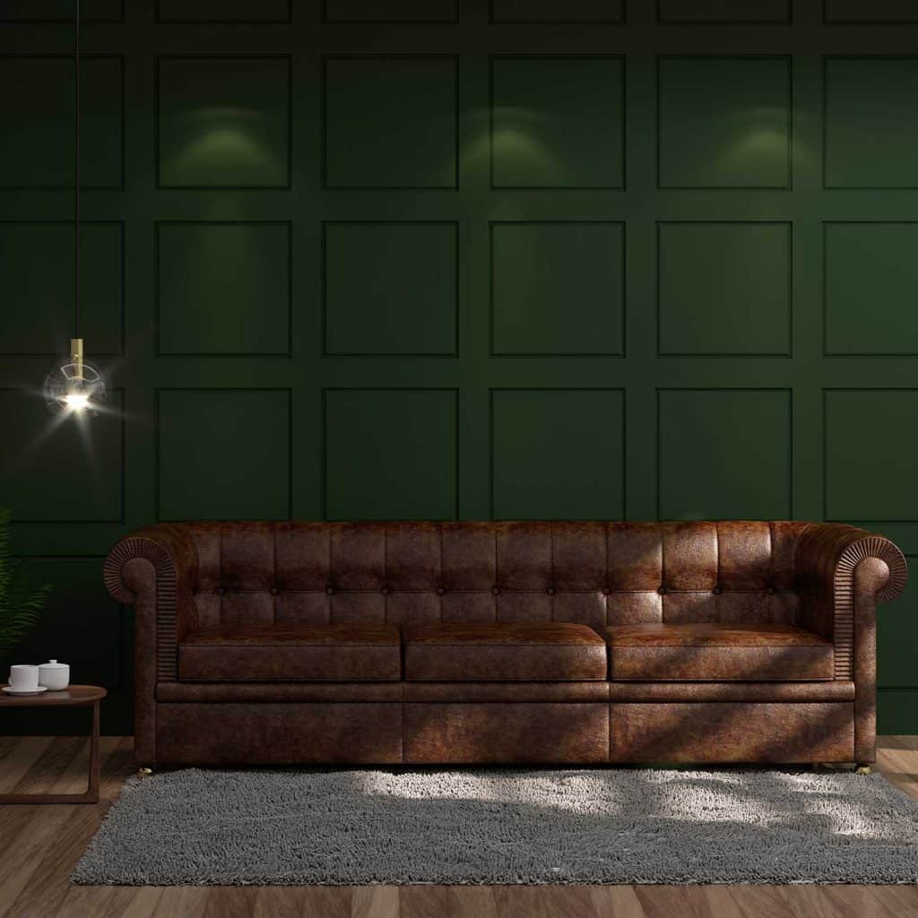 Modern living room with brown leather sofa, carpet, hardwood floor complementing a deep emerald green wall