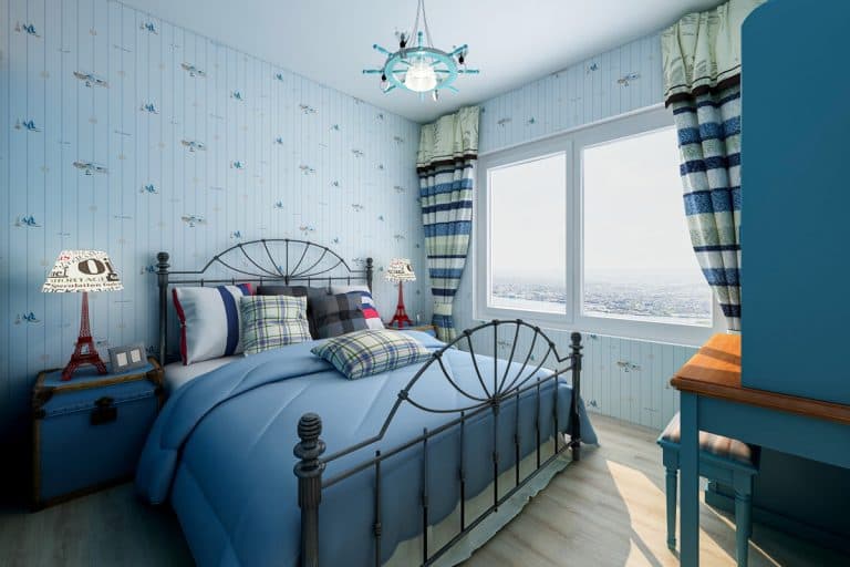A blue themed bedroom with a blue bed and a striped blue curtain, 12 Blue Curtain Ideas for Bedroom [Pictures and Inspiration]