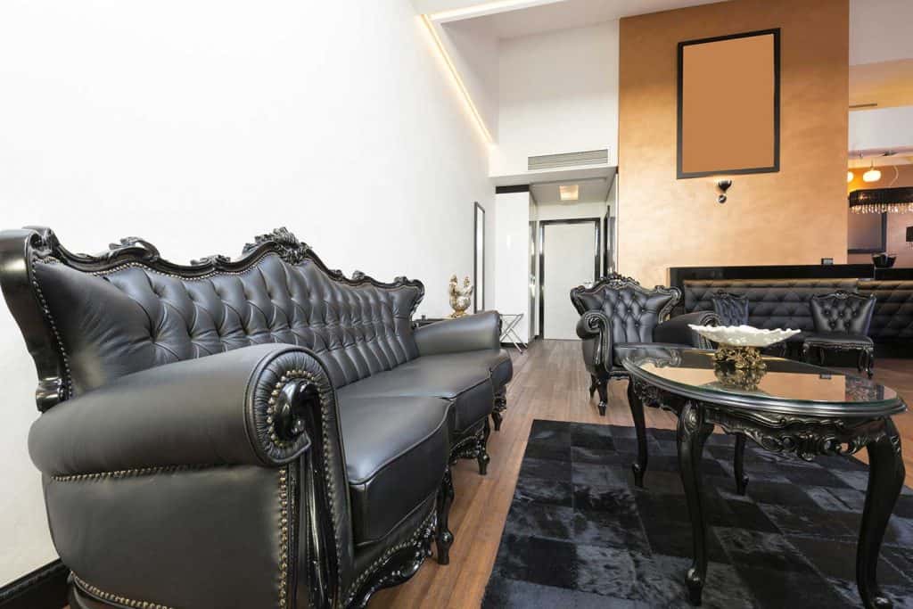Elegant luxury living room with black leather furniture