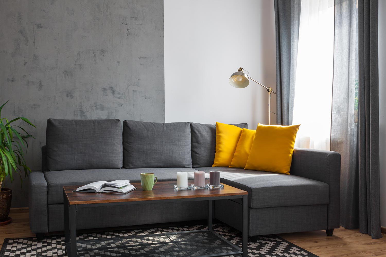 Gray sofa with yellow pillows in the living room