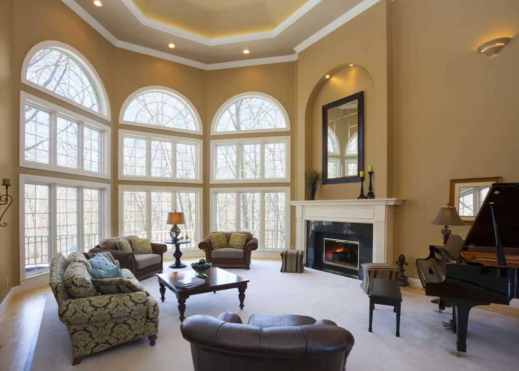 Homey great room with vaulted ceiling and grand piano