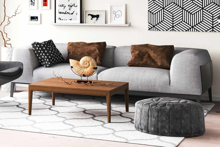 Modern living room with a gray couch and an accent chair with wooden flooring, What Pillows Go With a Gray Sofa? [31 Suggestions with Pictures]
