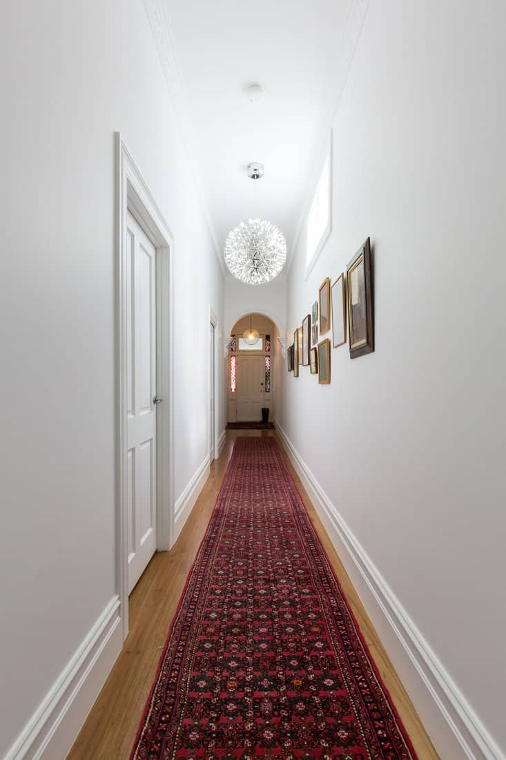 red runner rug in a hallway