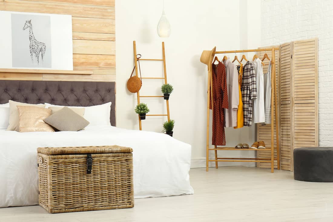 A modern Scandinavian themed bedroom with a dresser on the side, Does a Guest Room Need a Dresser?