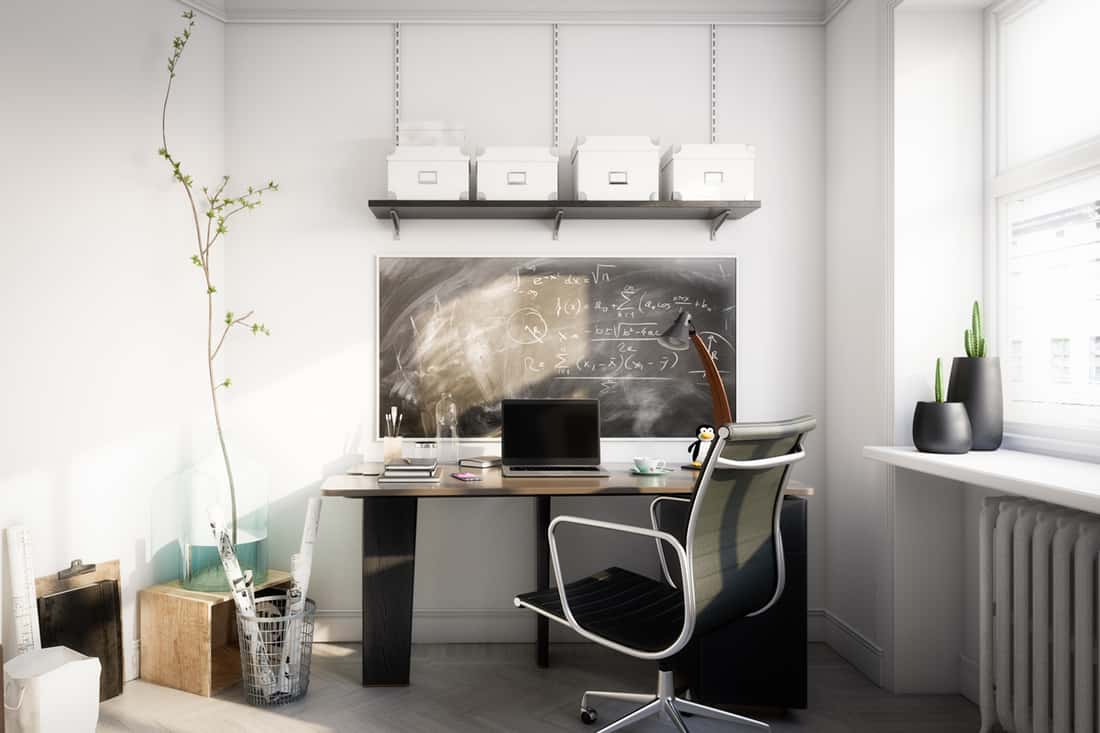 A modern office area with a desk and a laptop placed on top, What Size Desk Should I Get? [Typical sizes Discussed]