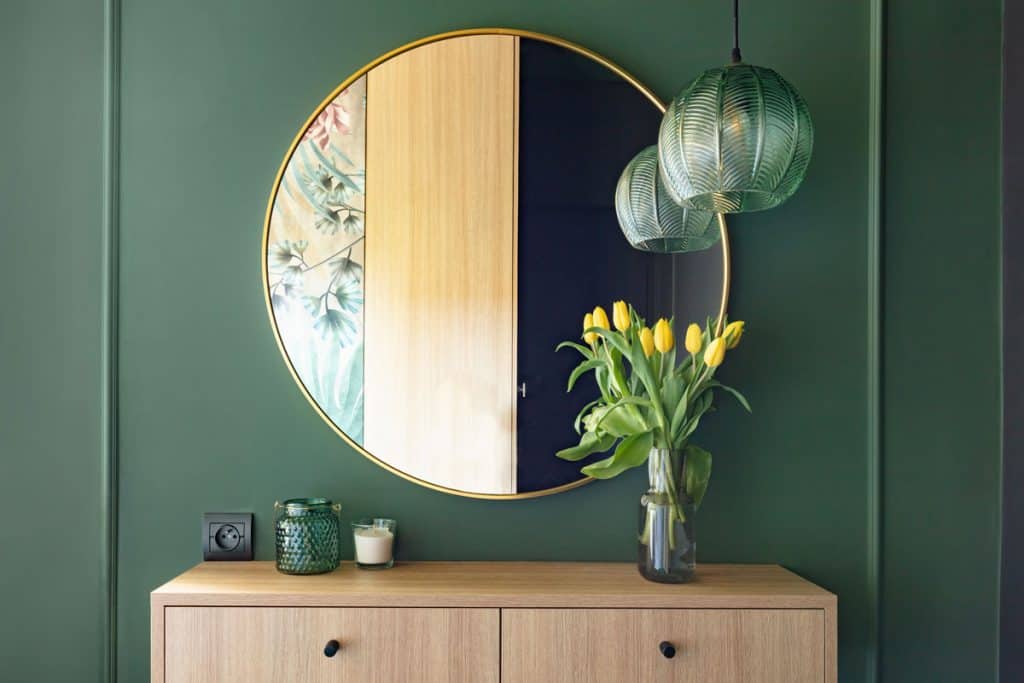 A round gold framed dresser mirror
