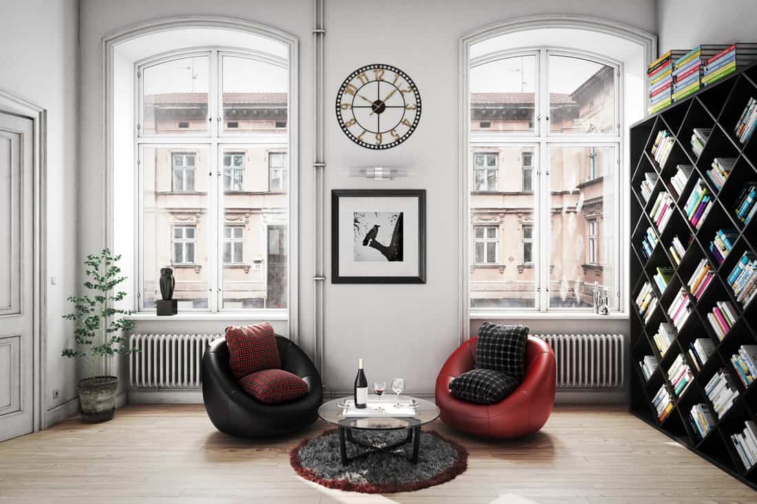 A well lit apartment room with white colored walls and a cool wall clock on the wall, How To Decorate Around A Wall Clock? [5 Fun Tips!]