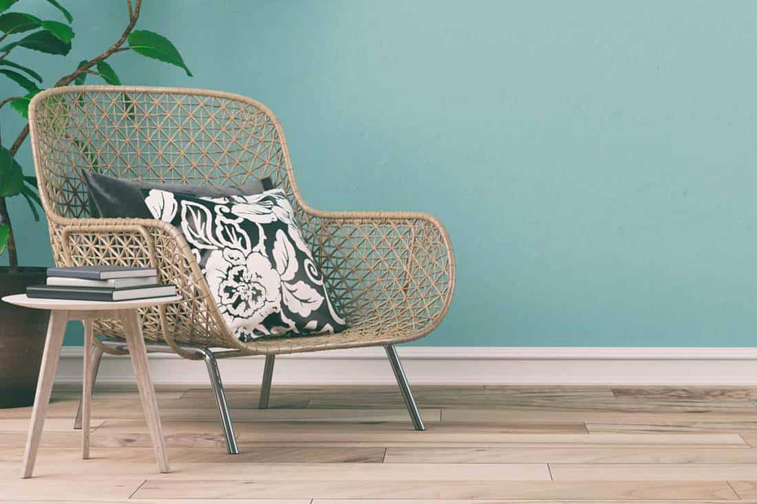 A wicker chair in an empty retro interior with mint colored wall, How to refurbish a wicker chair?