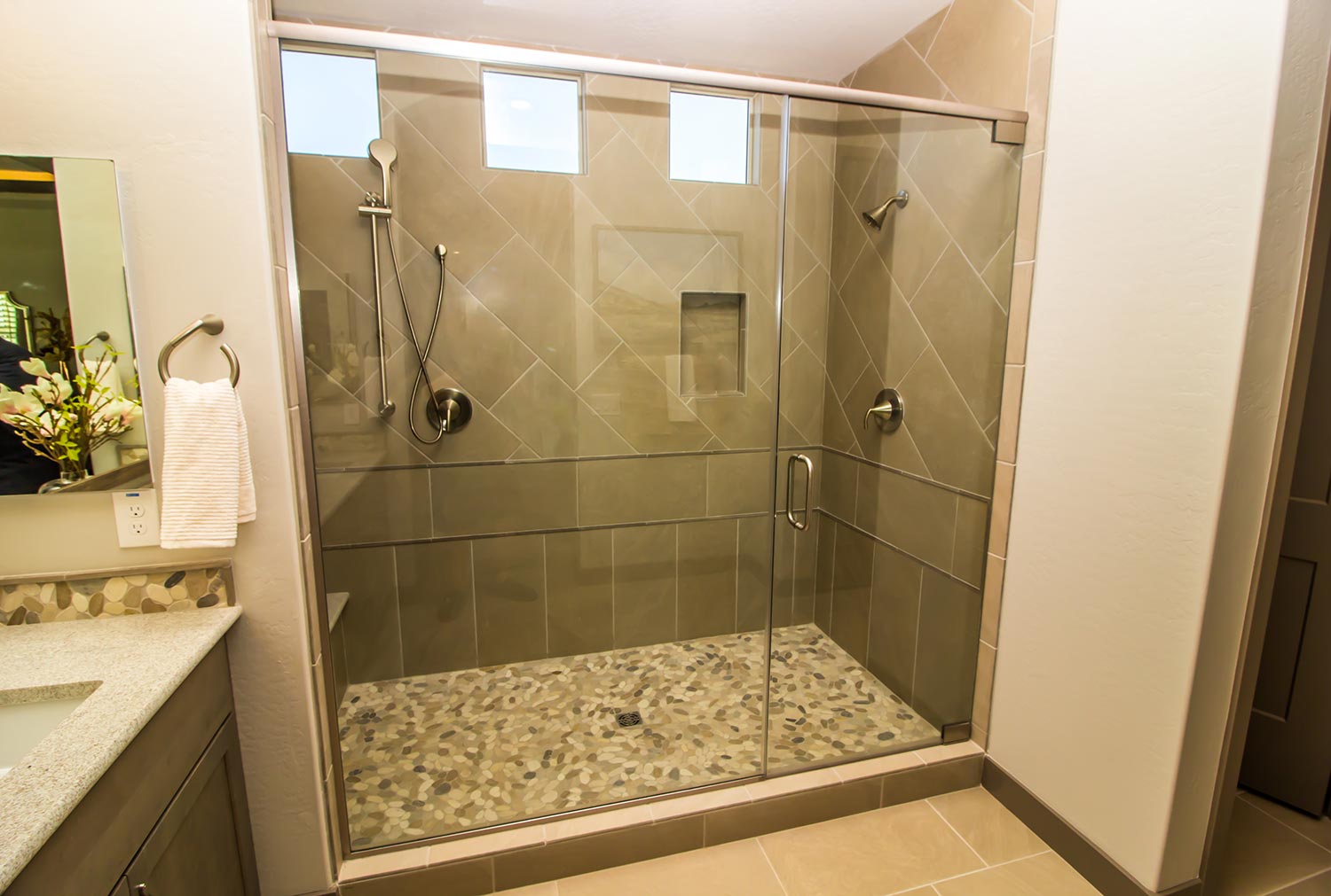 Bathroom glass shower with door, tile & two shower heads