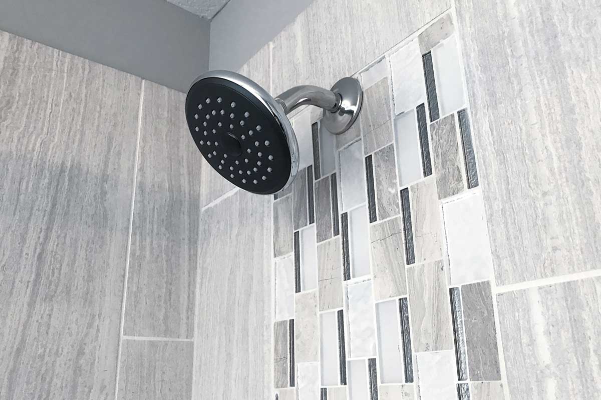 Bathroom shower interior with wall tile design, What Is The Best Material For Shower Walls? [5 Options Examined]
