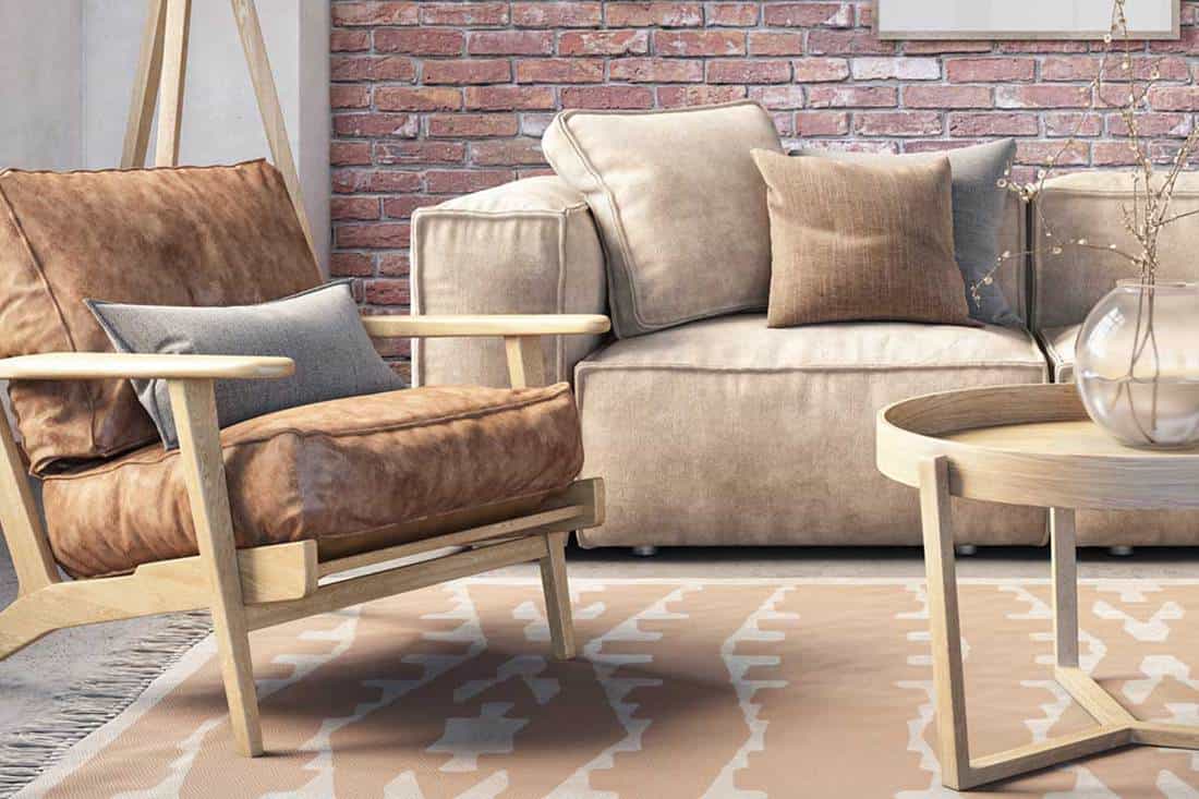 Beige leather sofa and accent chair in a bohemian living room interior with brick wall, What Accent Chairs Go With A Leather Sofa?