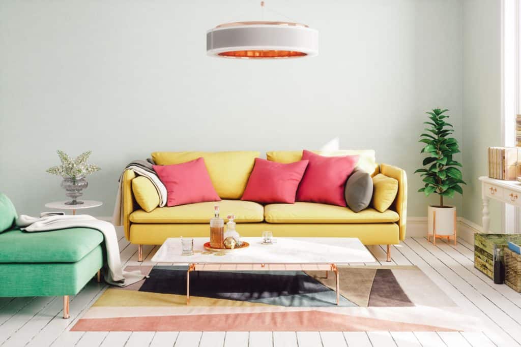Bright colored furnitures and a colored rug on the middle