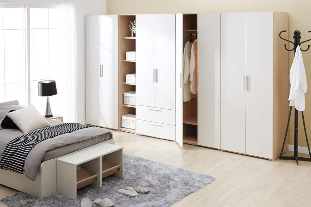Huge white wardrobe inside a minimalist bedroom