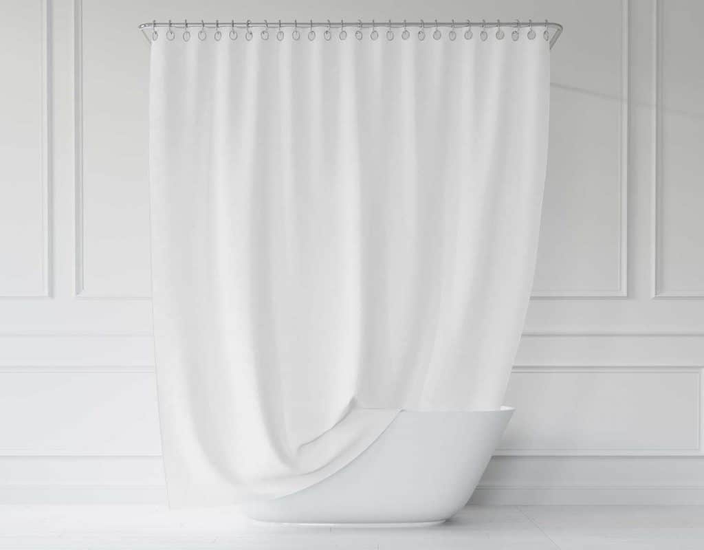 Light bathroom interior with white bathtub and shower curtain