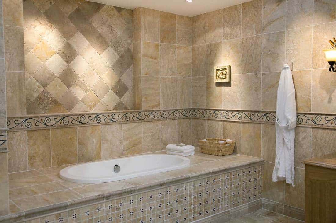Luxurious modern bathroom with matching bathroom floor and wall tiles
