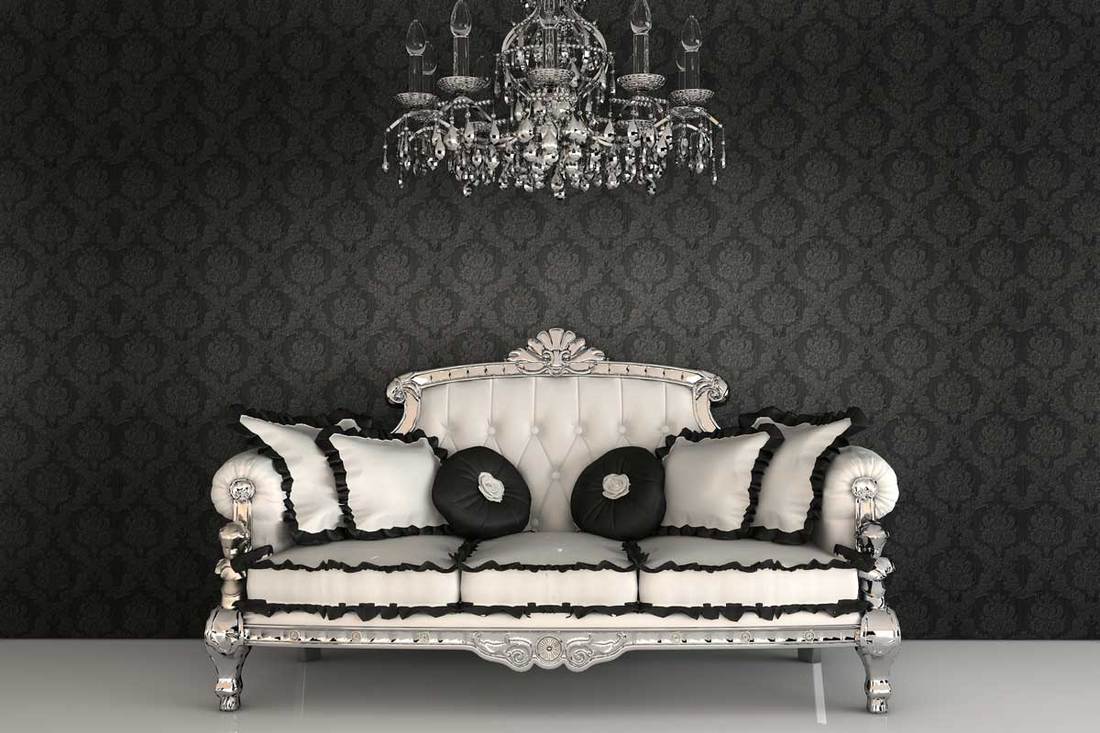 Royal sofa with pillows and chandelier in luxurious interior