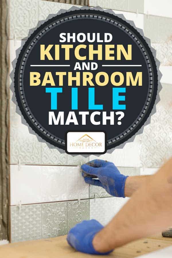 Tiler hand installing ceramic tiles on the wall, Should Kitchen And Bathroom Tile Match?