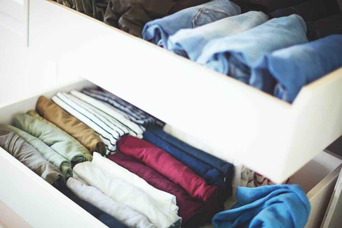 Variety of clothing systematically arranged in a dresser drawer, Should You Line The Dresser Drawers?
