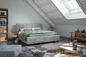 A loft bedroom with white painted walls, gray bedding sets, and different textured tiles, Can Bedrooms Have Different Flooring?