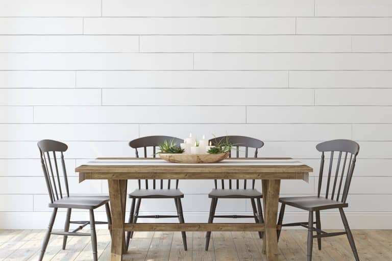 A modern farmhouse themed dining room with wooden chairs and wooden flooring, How to Paint a Dining Room Table [4 Steps]
