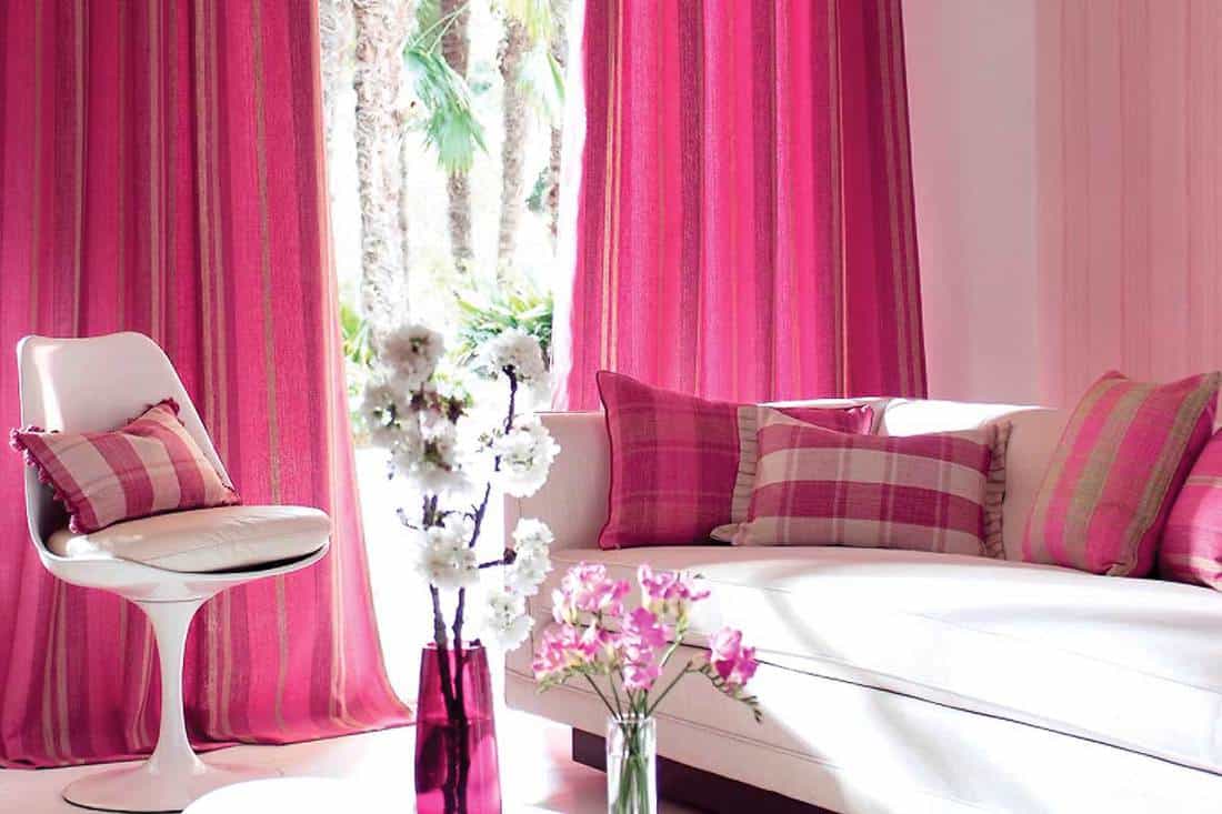 Contemporary living room with sofa and pink curtains, 4 Types of Curtains that Are Best for Privacy