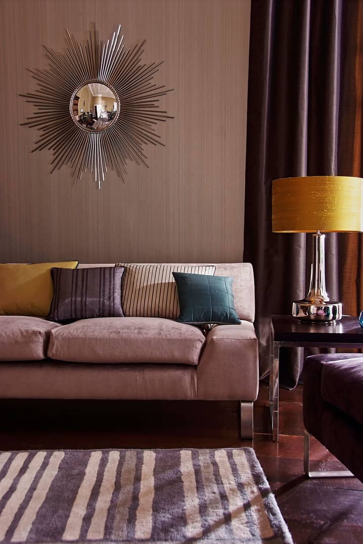 Contemporary lounge living room with sofa, brown curtains and ornaments
