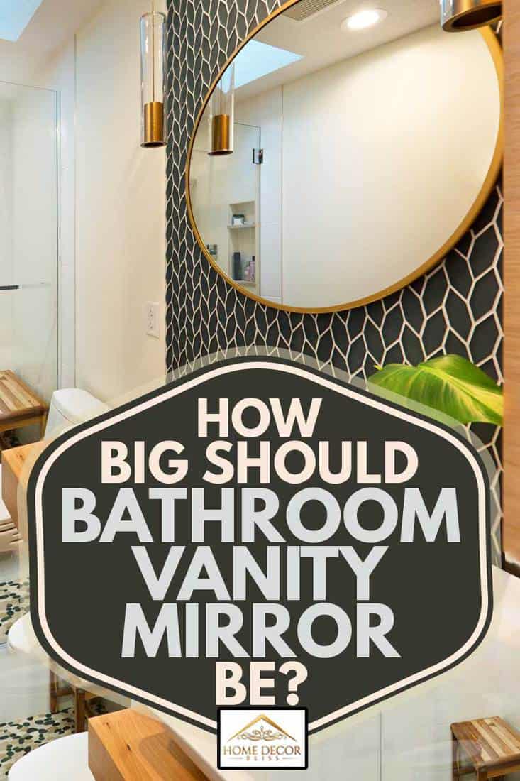A contemporary modern bathroom design. featuring a round mirror, an above counter vessel sink, custom built vanity with storage, toilet and walk-in glass shower stall, How Big Should Bathroom Vanity Mirror Be?