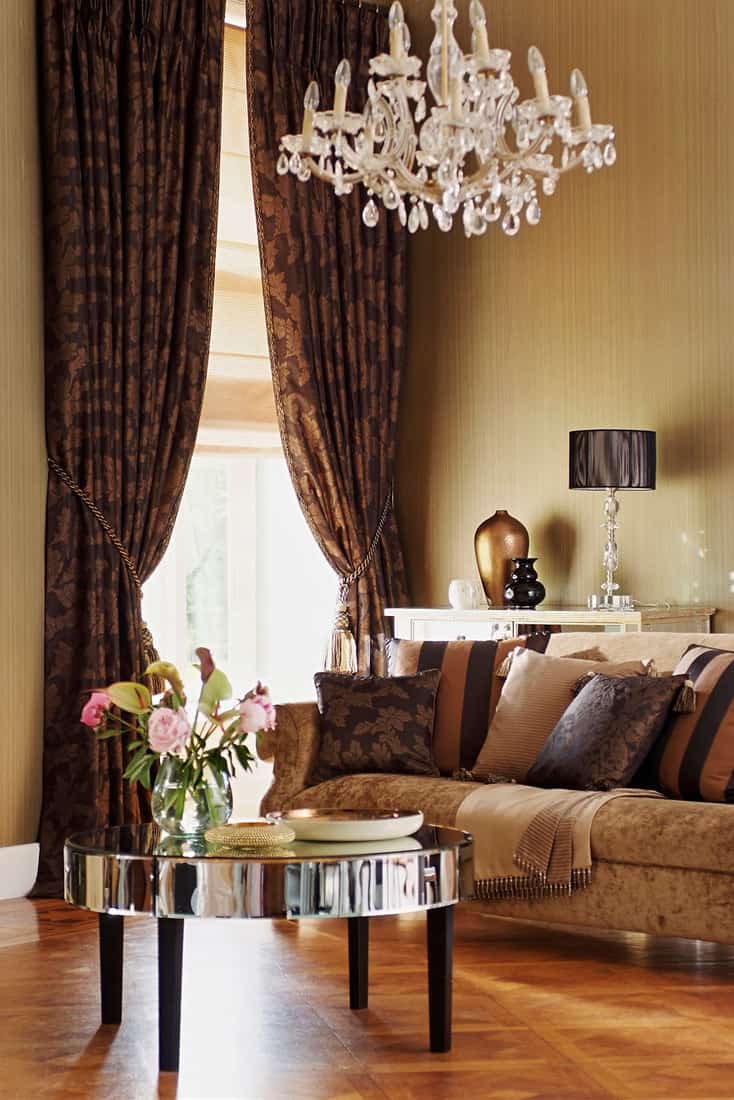 Luxurious and stylish home living room interior with high-quality furniture and brown curtains