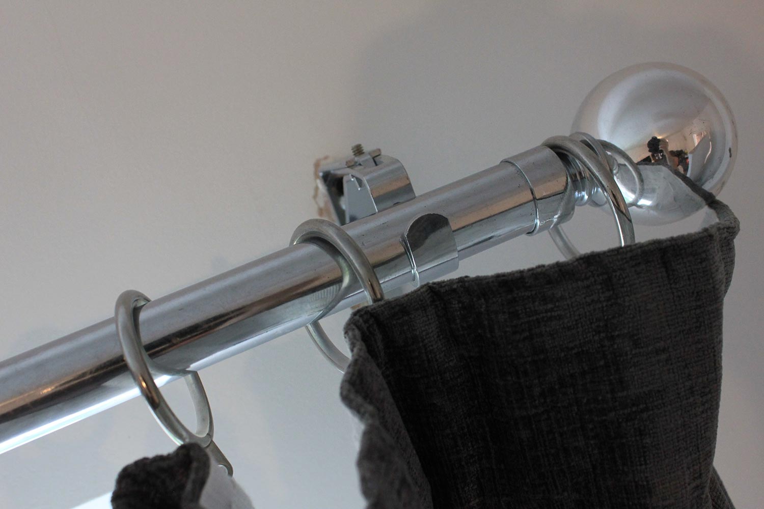 Silver metallic curtain pole and curtains