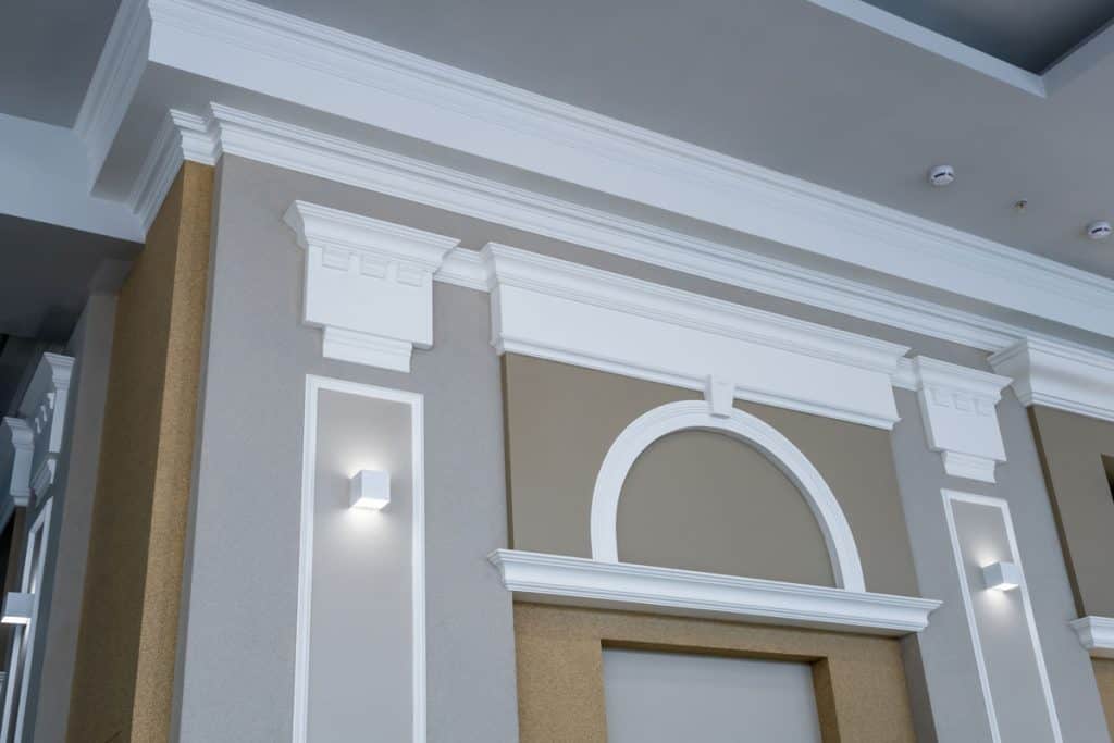White crown molding and matching brown and gray walls