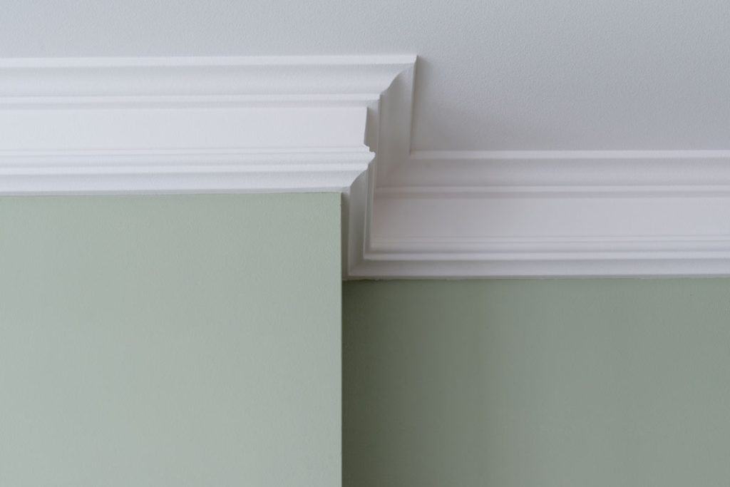 White crown molding and mint green wall