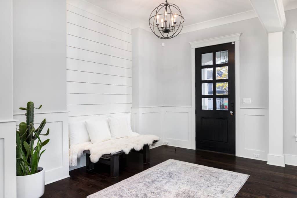 White painted walls inside a modern house witht black hardwood flooring