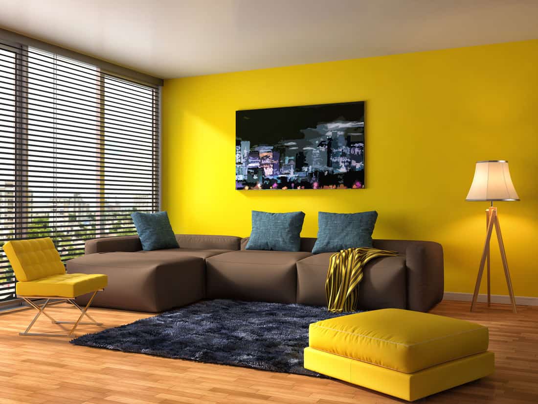 living room yellow walls gray furniture