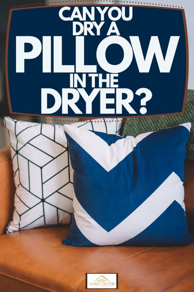 A white and blue throw pillows arranged on a brown leather sofa, Can You Dry A Pillow In The Dryer?