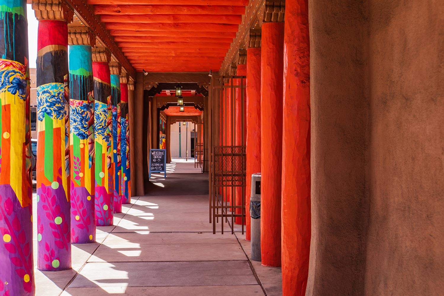 Colorfully painted columns on the plaza