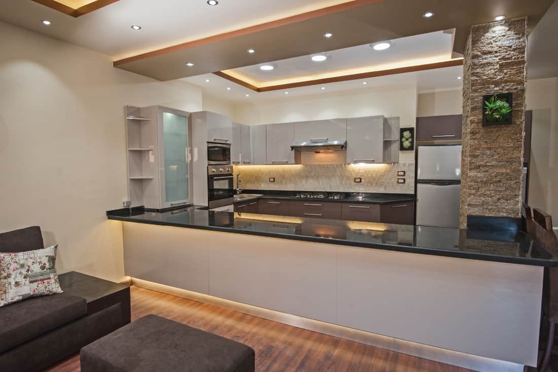 Interior design decor showing modern kitchen and appliances in luxury apartment showroom