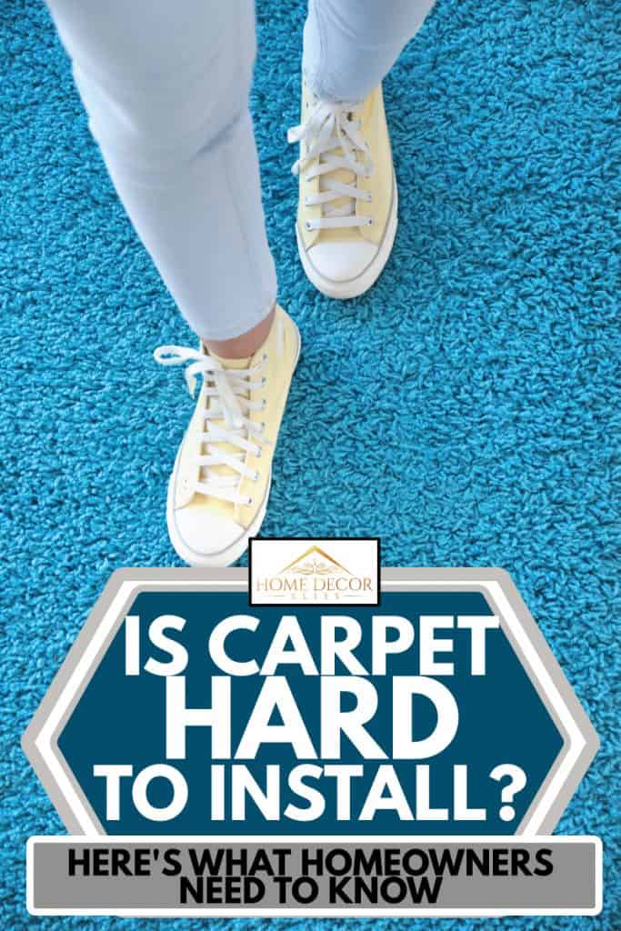 Woman standing on soft blue carpet floor, Is Carpet Hard To Install? Here's what homeowners need to know