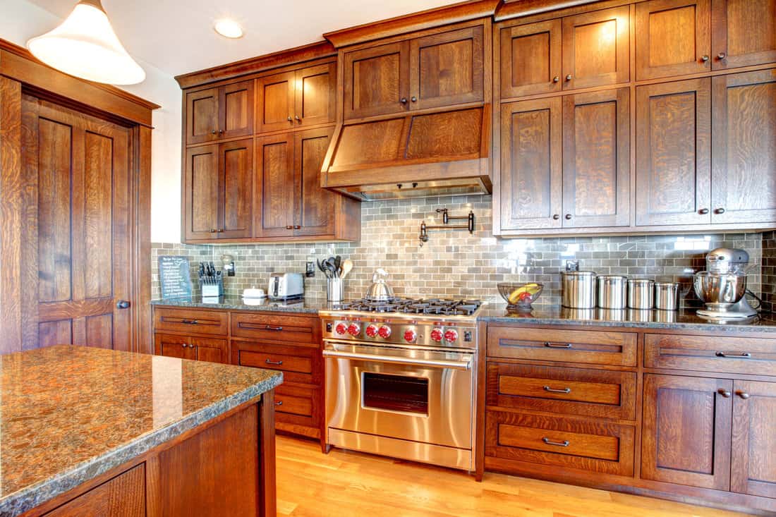 Luxury pine wood beautiful custom kitchen interior design with island and granite.
