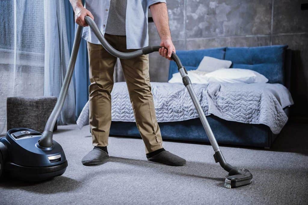 Man with vacuum cleaner