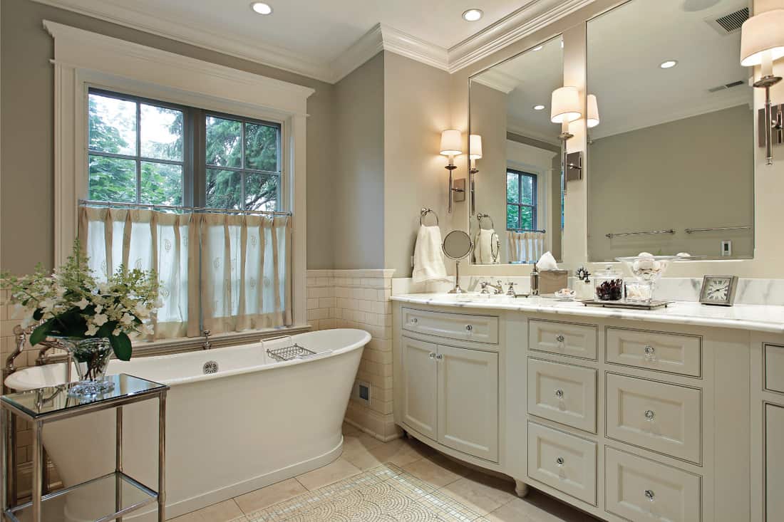 Master bathroom with marble counter and colored flooring