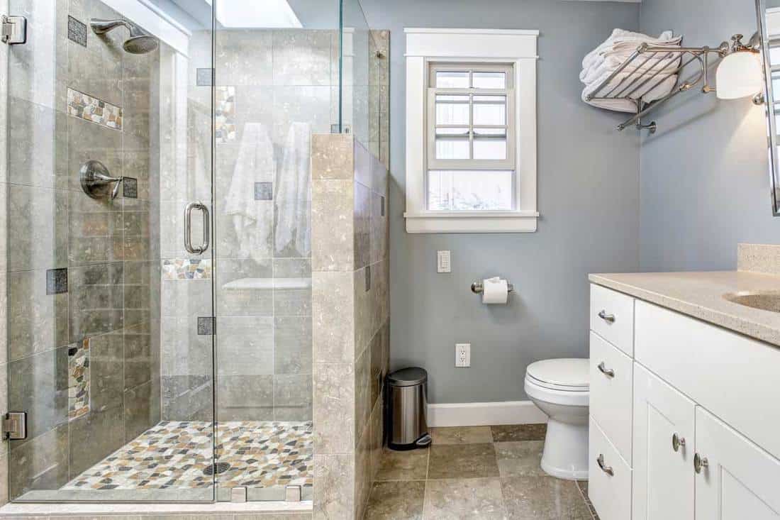 Modern bathroom interior with glass door shower, How High Should Shower Doors Go?