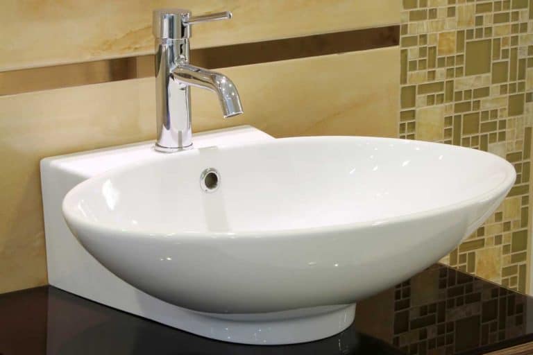 Modern bathroom sink with stainless faucet and mirror, How To Paint Bathroom Sink Faucets [6 Steps]