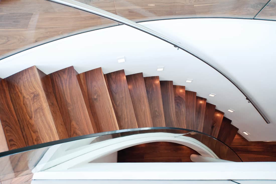 Curved staircase of a modern home, How Wide Should A Staircase Be [By Type of Staircase]?